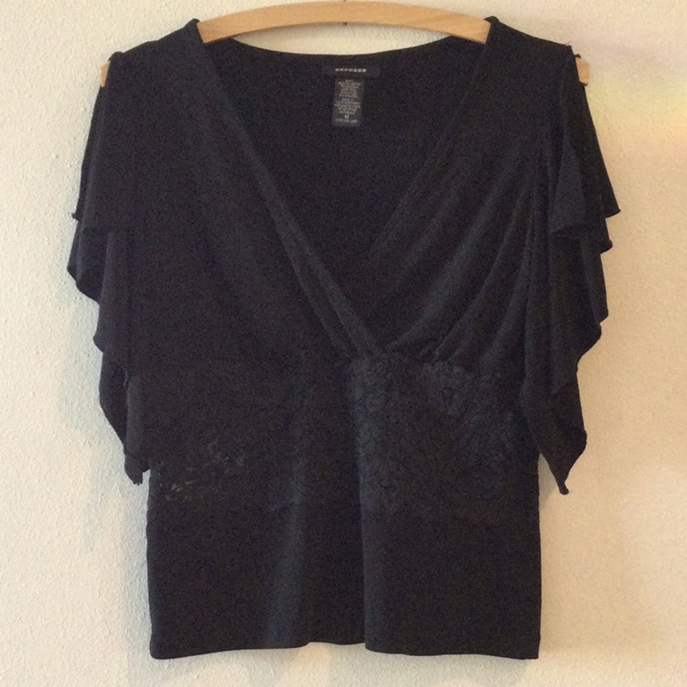 Women’s black short sleeve black top.